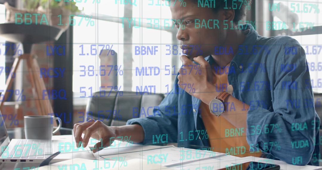 African American Businessman Analyzing Data with Technology Overlay