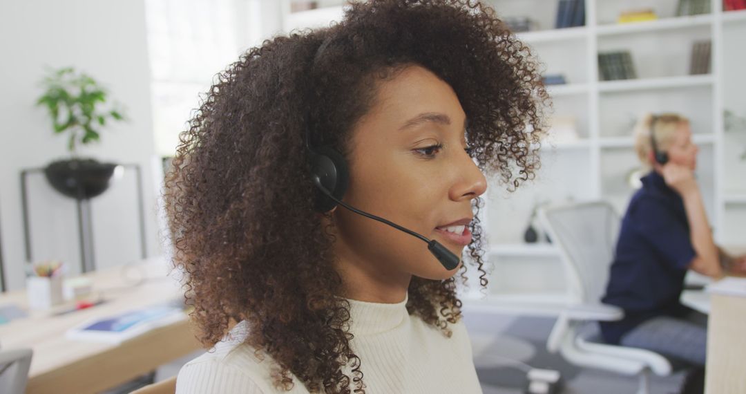 Professional Customer Service Representative Wearing Headset in Modern Office - Free Images, Stock Photos and Pictures on Pikwizard.com