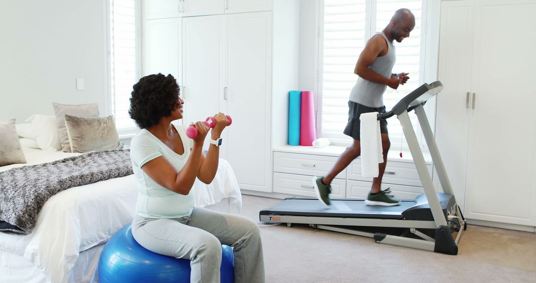 Senior Couple Exercising at Home on Treadmill and Exercise Ball - Free Images, Stock Photos and Pictures on Pikwizard.com