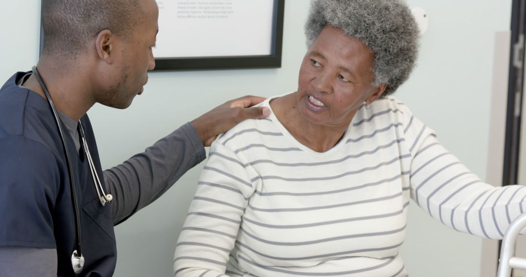 Doctor Comforting Senior Female Patient During Medical Check-Up - Free Images, Stock Photos and Pictures on Pikwizard.com