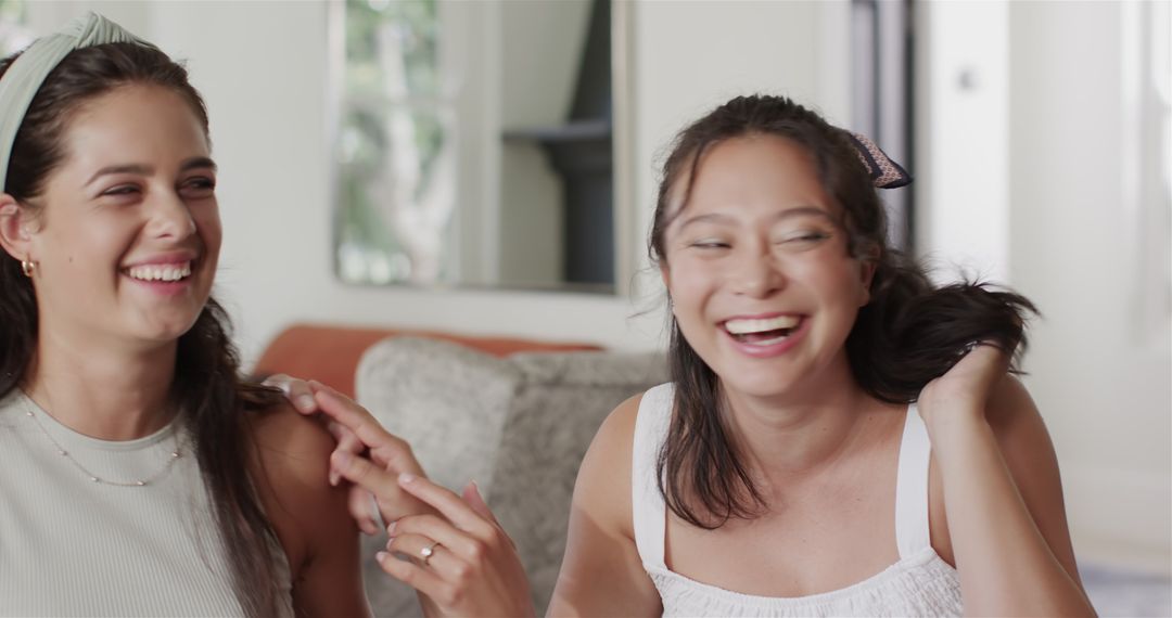 Friends Enjoy Interactive Laughter in Cozy Home Setting