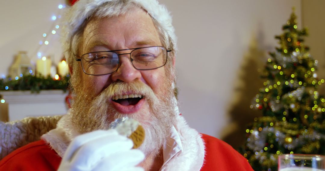 A Caucasian senior man dressed as Santa Claus enjoys a cookie, with copy space - Free Images, Stock Photos and Pictures on Pikwizard.com