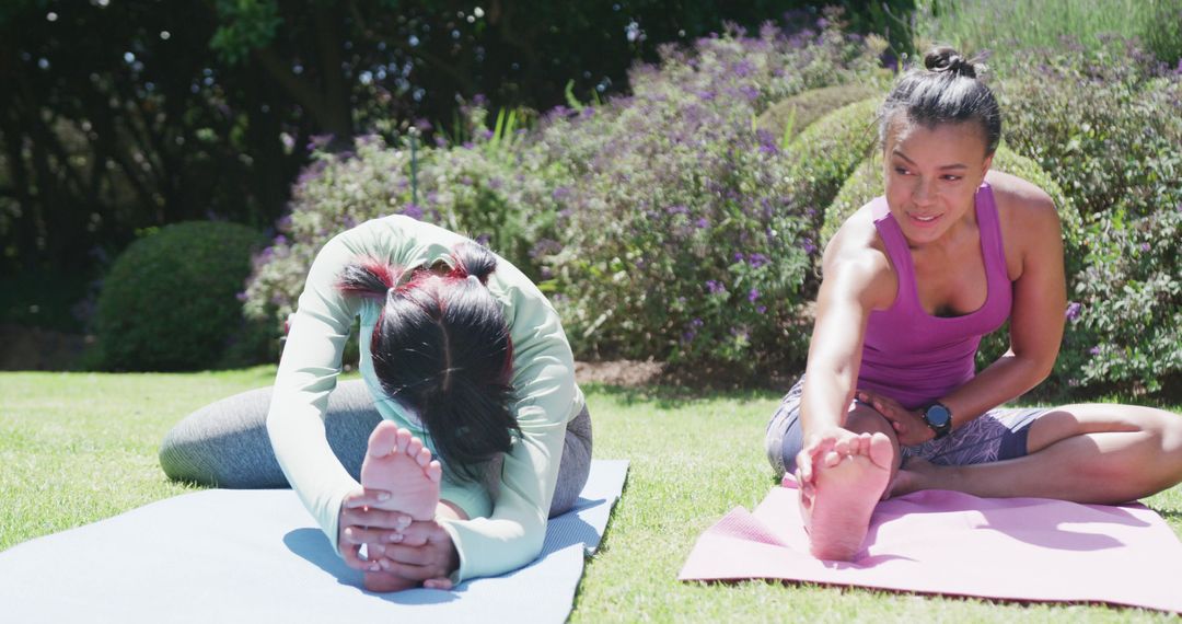 Two Women Practicing Yoga Outdoor on Sunny Day - Free Images, Stock Photos and Pictures on Pikwizard.com