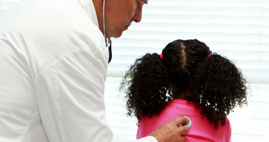 Doctor Examining Young Girl with Stethoscope During Checkup - Free Images, Stock Photos and Pictures on Pikwizard.com