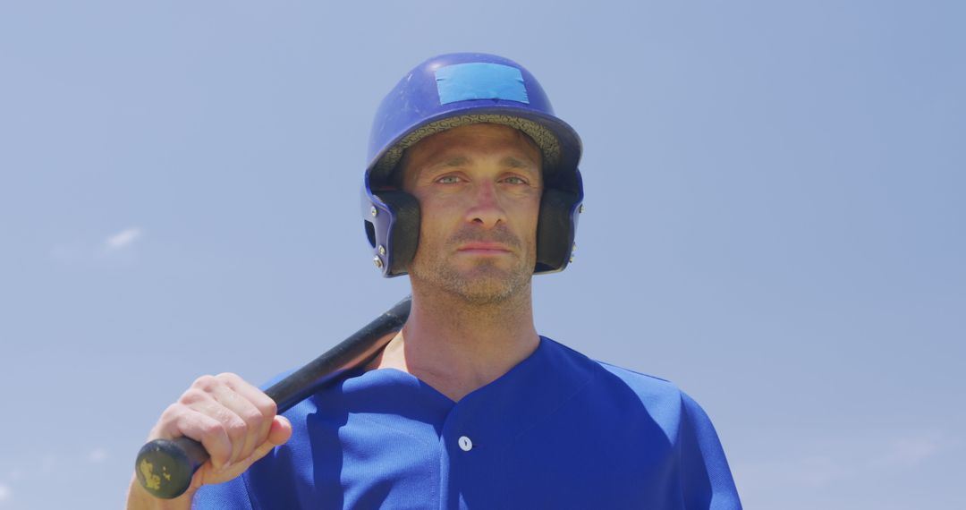 Serious Baseball Player Holding Bat Outdoors - Free Images, Stock Photos and Pictures on Pikwizard.com