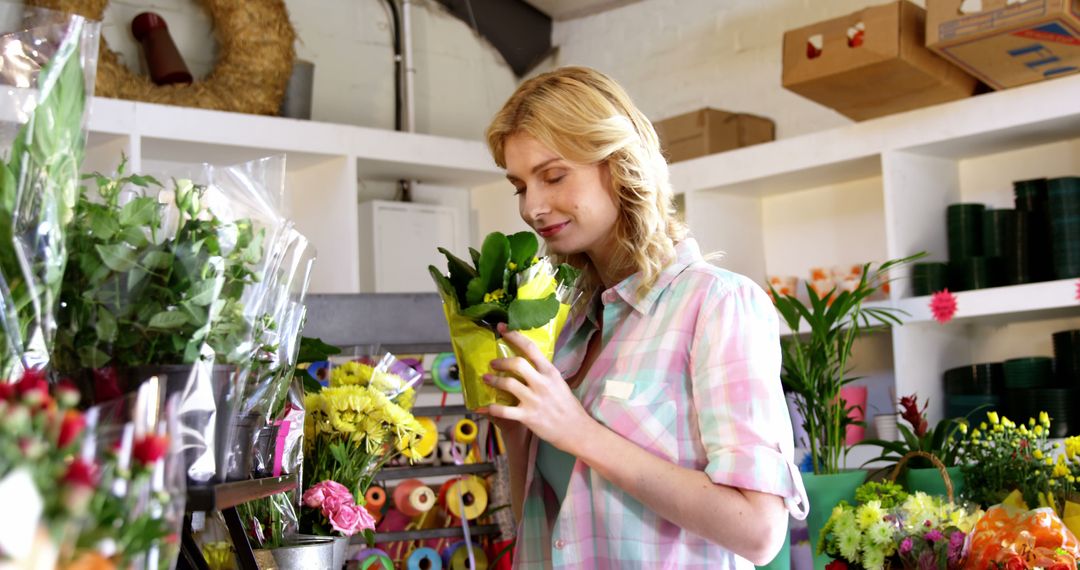 Woman Enjoying Fresh Flowers in Flower Shop - Free Images, Stock Photos and Pictures on Pikwizard.com