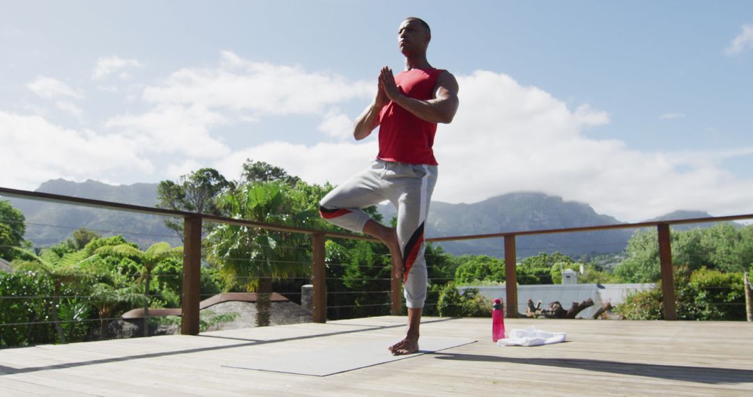 Man Balancing in Tree Pose Outdoor Terrace Yoga Practice