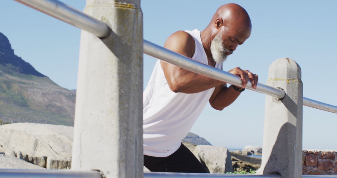 Elderly Man Exercising Outdoors with Push-Ups on Railings - Free Images, Stock Photos and Pictures on Pikwizard.com