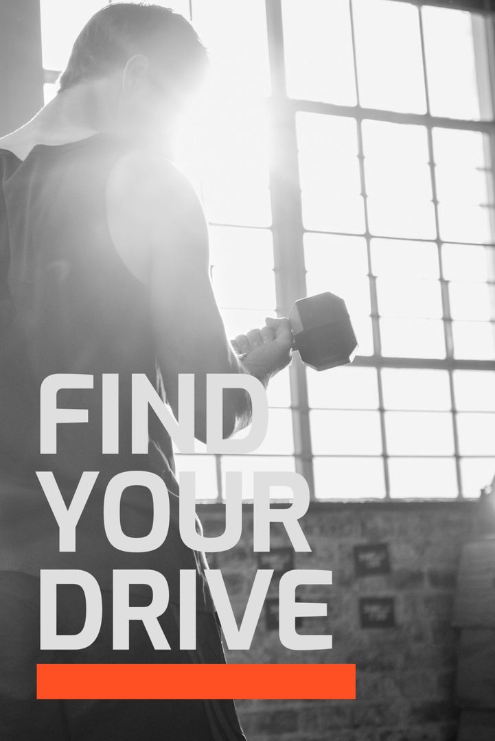 Determined Man Lifting Weights in Sunlit Gym Space