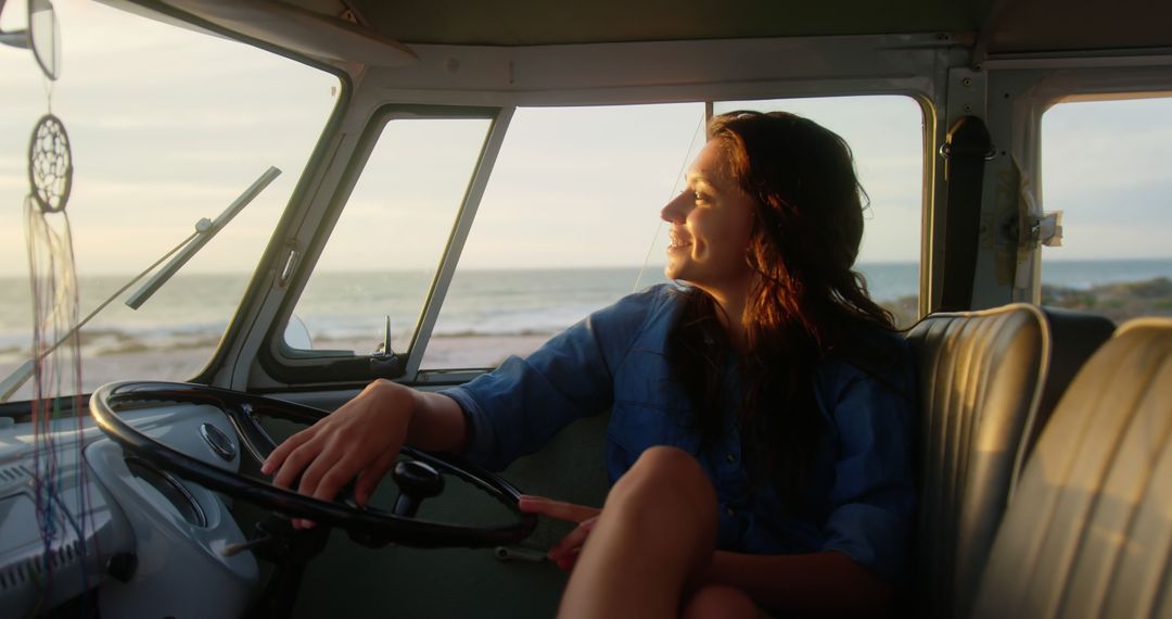 Young Woman Enjoying Sunlight in Vintage Camper by Ocean - Free Images, Stock Photos and Pictures on Pikwizard.com