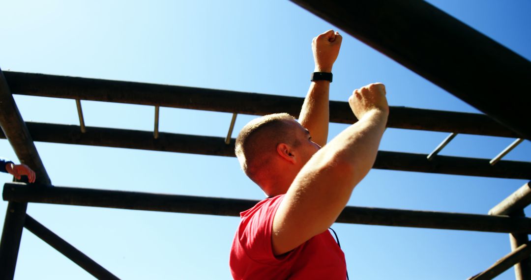 Fit Man Training on Outdoor Monkey Bars During Workout - Free Images, Stock Photos and Pictures on Pikwizard.com