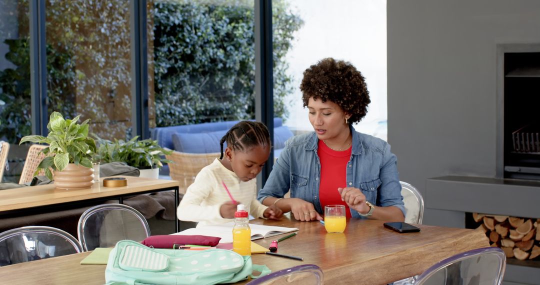 Mother and Daughter Bonding over Homework in Modern Home