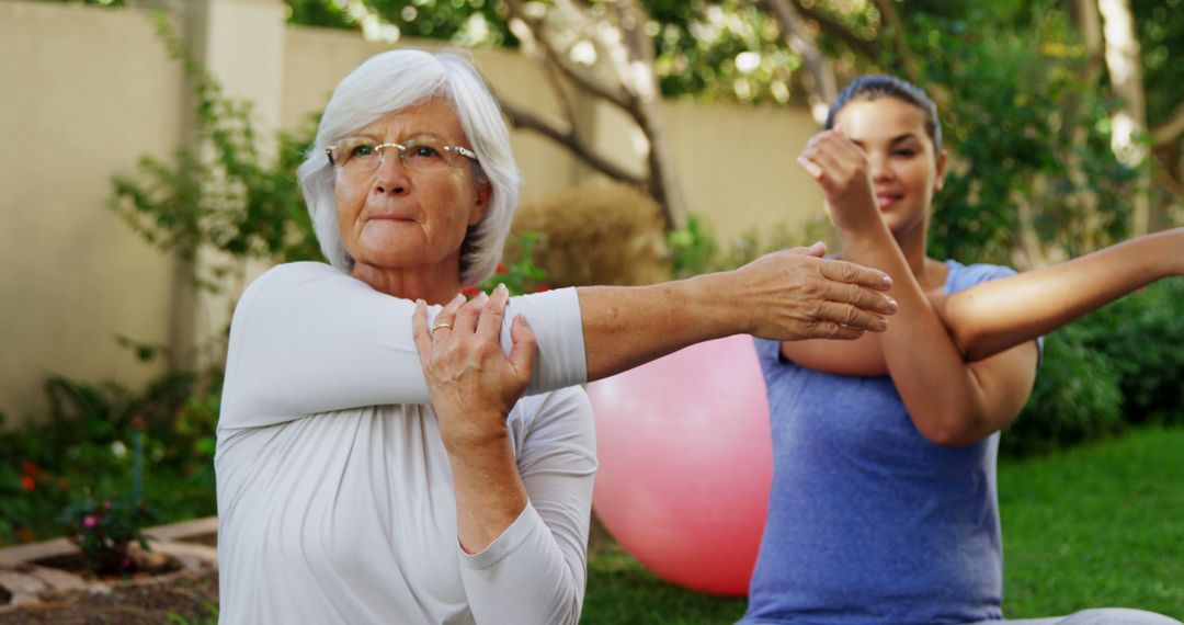 Senior Woman and Young Woman Exercising in Garden Doing Stretches - Free Images, Stock Photos and Pictures on Pikwizard.com