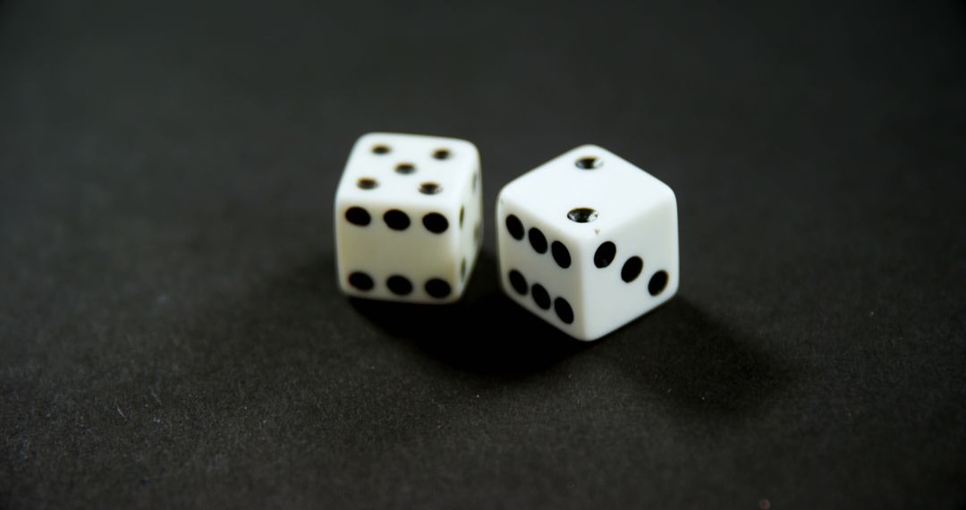 Close-up of Two White Dice on Dark Surface - Free Images, Stock Photos and Pictures on Pikwizard.com