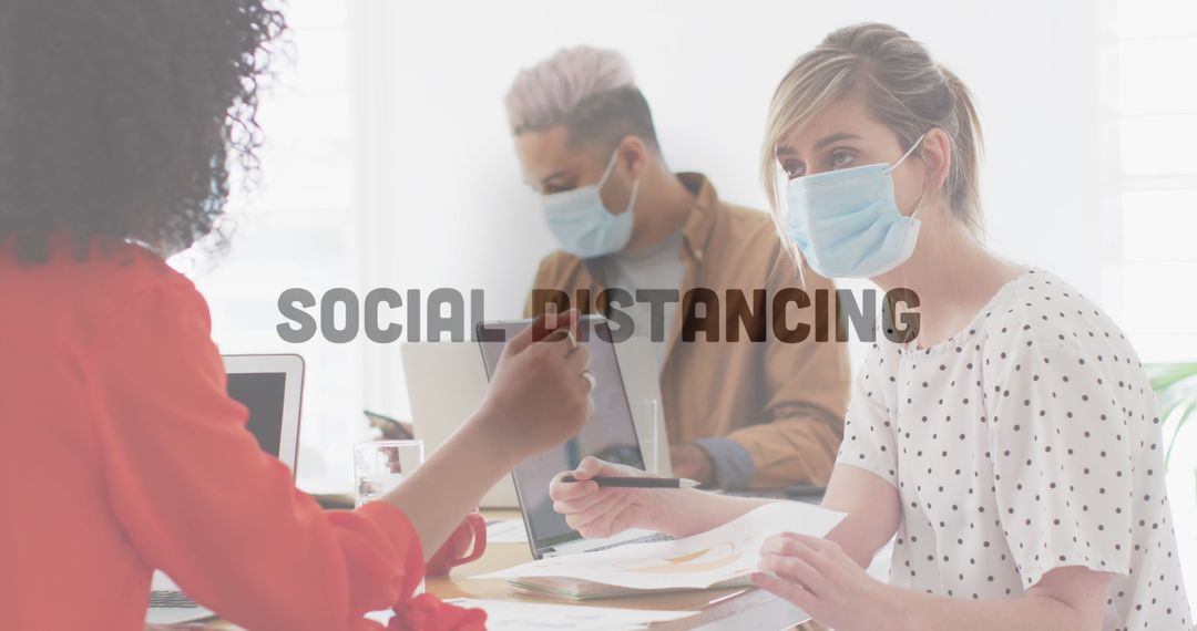 Office Colleagues Practicing Social Distancing during Pandemic