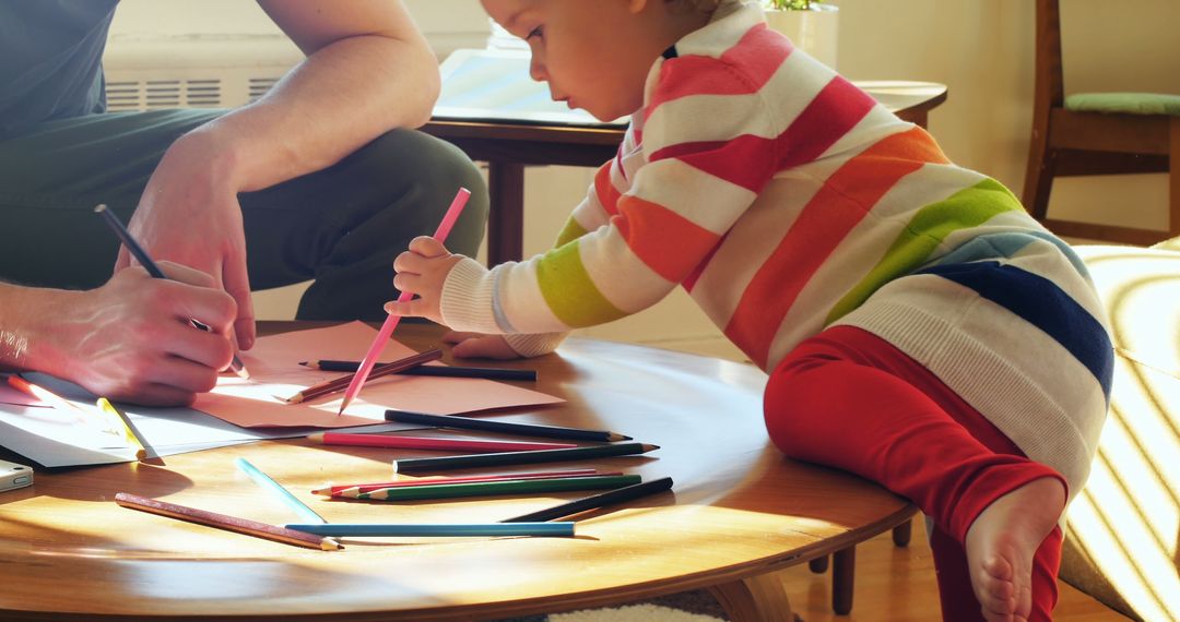 Parent and Child Drawing Together with Colored Pencils - Free Images, Stock Photos and Pictures on Pikwizard.com