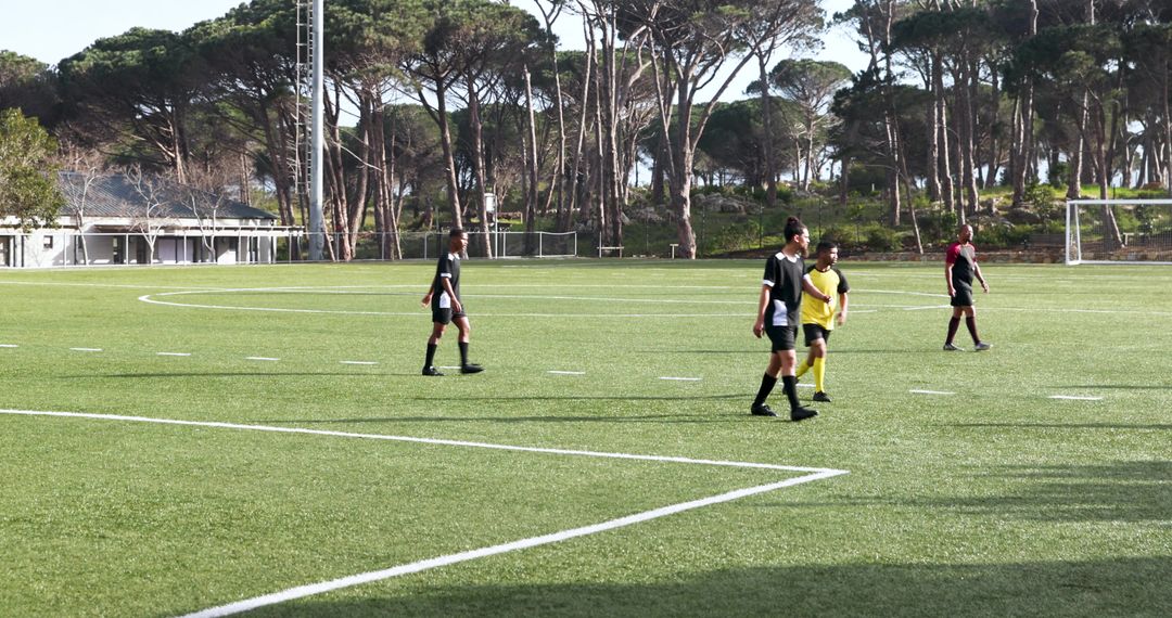 Young Soccer Players Participating in Practice Session Outdoors