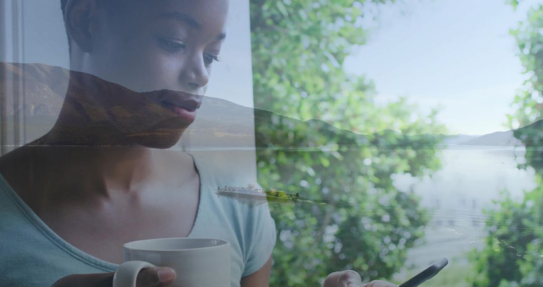 Woman Relaxing with Coffee and Smartphone by Tranquil Lake View