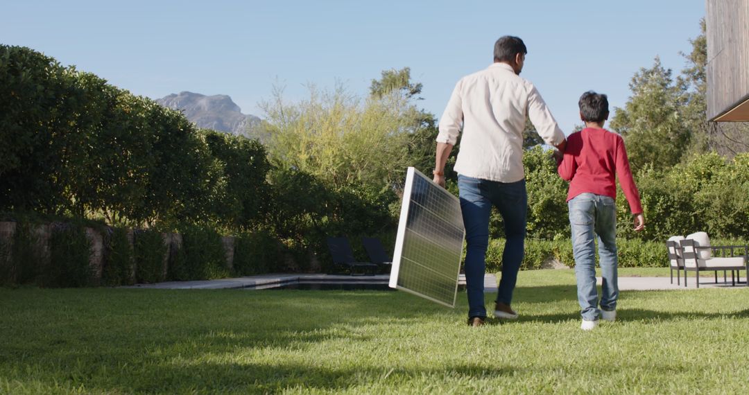 Father and Son Bonding with Solar Panel in Scenic Backyard Setting