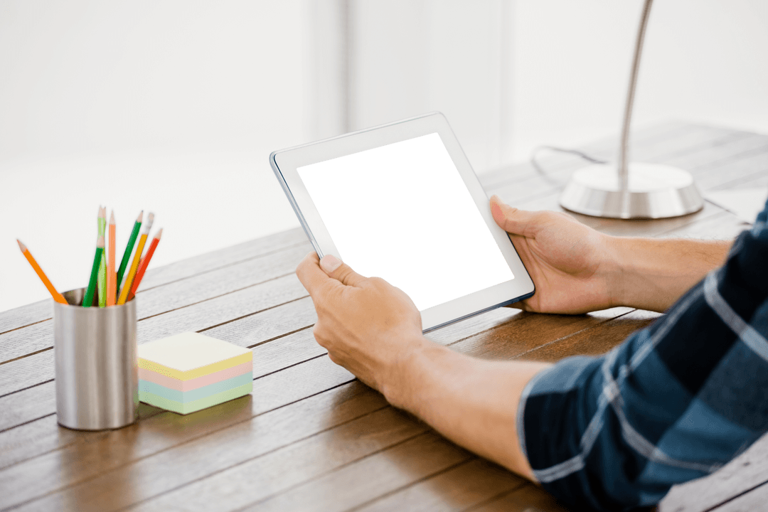 Hands Holding Transparent Table on Modern Desk, Digital Workspace Concept