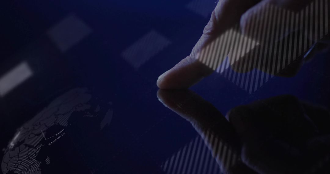 Fingertip Touching Dark Touchscreen with World Map Data Overlay and Reflective Interface