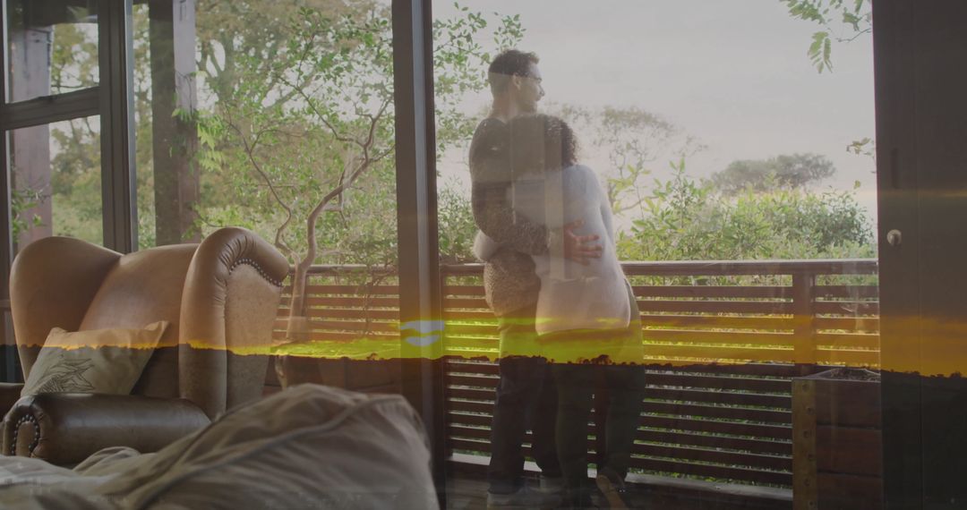 Couple Embracing by Glass Door Overlooking Scenic View
