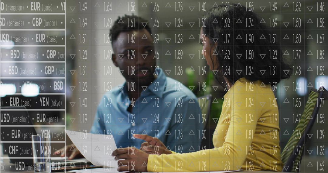 Two Analysts Discussing Documents with Digital Currency Overlay