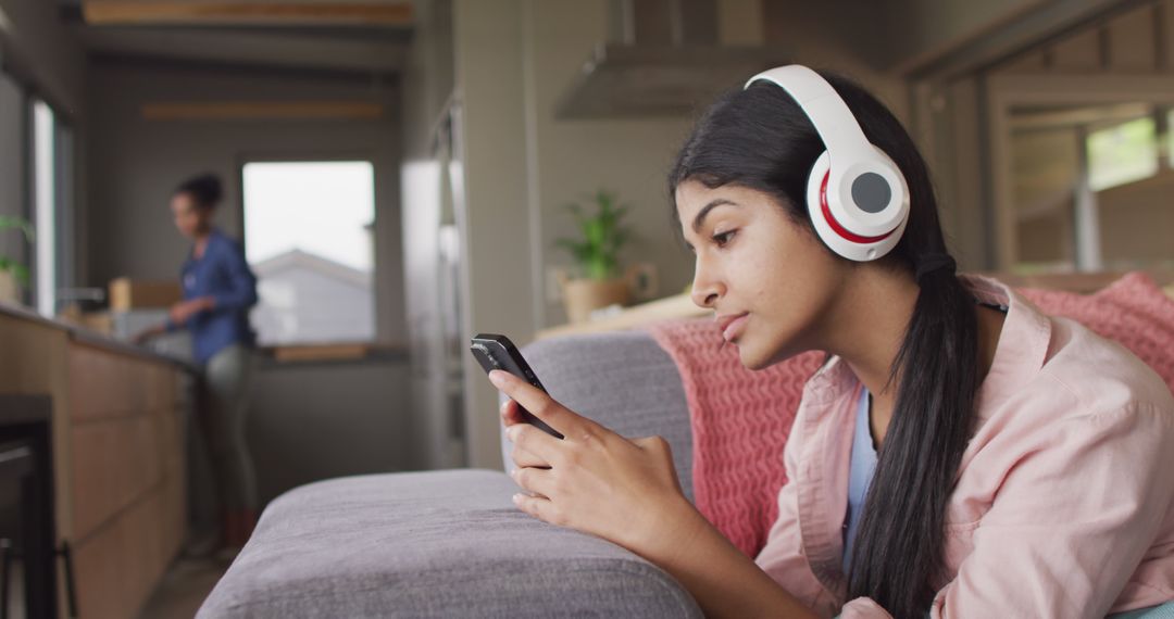 Teen Girl Relaxing On Couch Listening Music - Free Images, Stock Photos and Pictures on Pikwizard.com