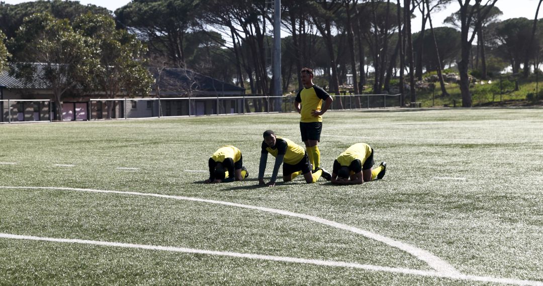 Soccer Team Practicing Together on Artificial Turf Field
