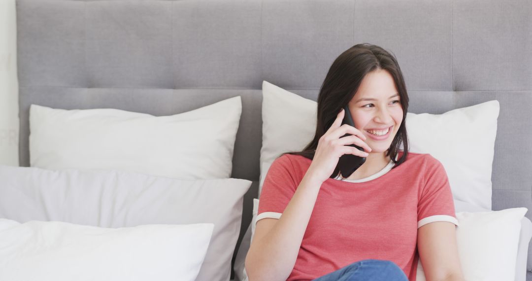 Smiling Woman Talking on Phone While Relaxing in Bed - Free Images, Stock Photos and Pictures on Pikwizard.com