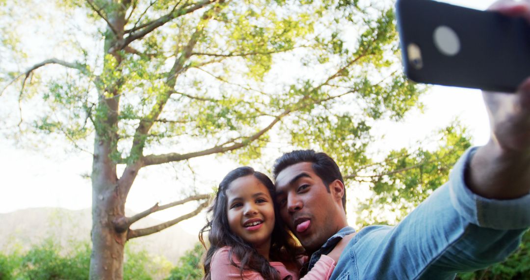 Father and Daughter Enjoying Outdoor Selfie Together - Free Images, Stock Photos and Pictures on Pikwizard.com