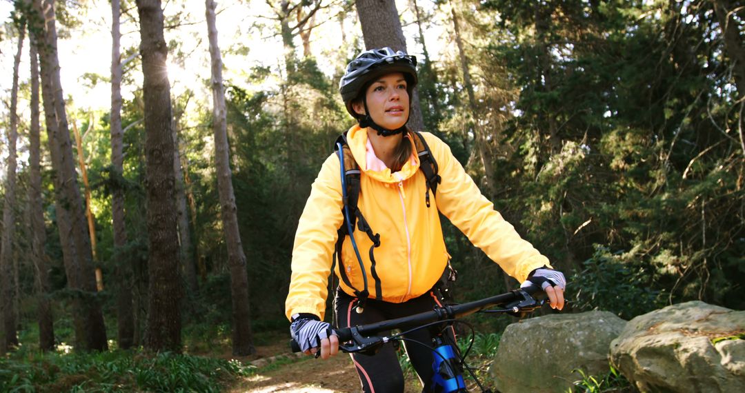 Woman Enjoying Mountain Bike Ride in Forest - Free Images, Stock Photos and Pictures on Pikwizard.com