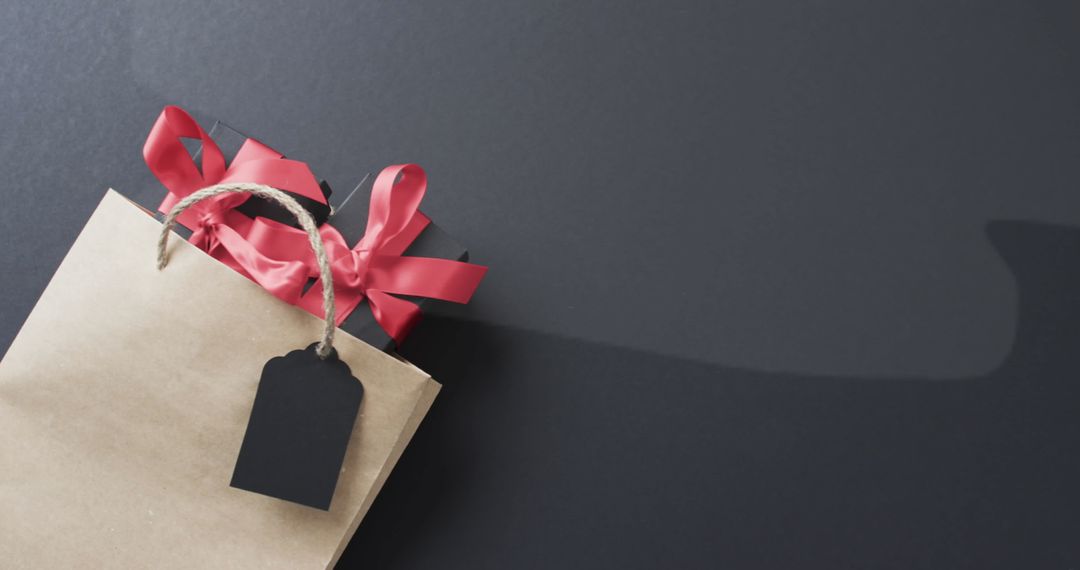 Cyber Monday Shopping Bag with Red Ribbon and Gift Tag