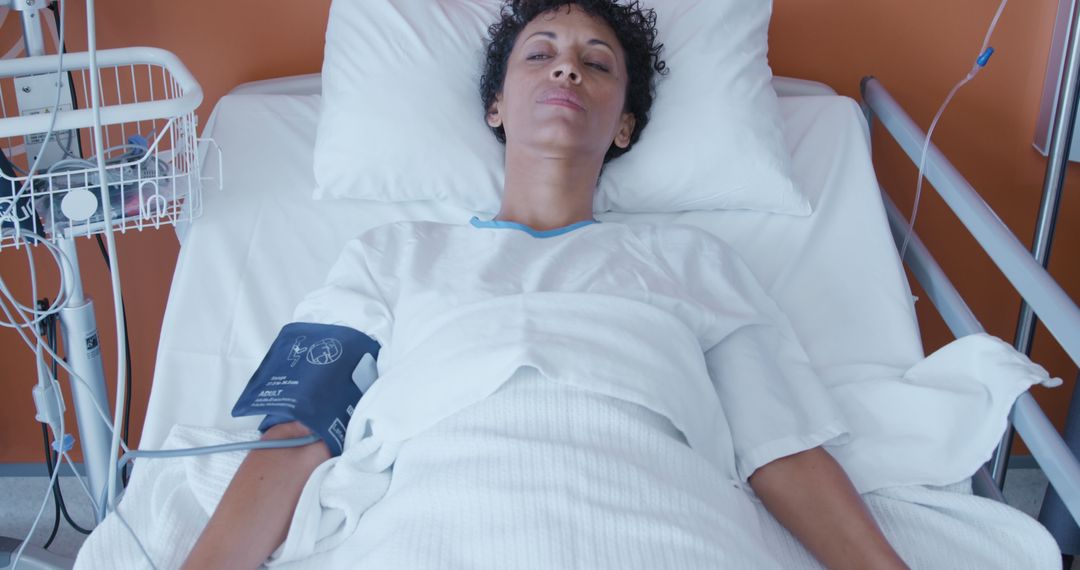 African American patient resting in hospital bed with medical equipment - Free Images, Stock Photos and Pictures on Pikwizard.com