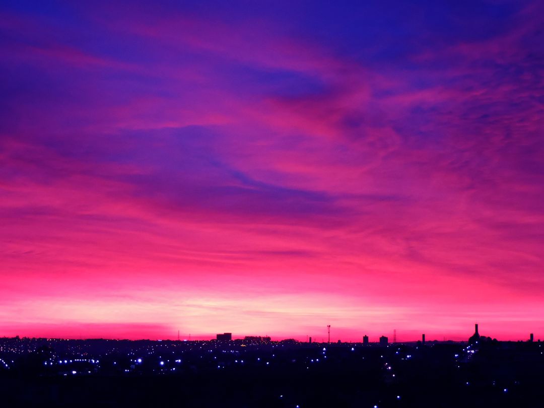 Vibrant Purple and Pink Sunset Over Silhouetted Cityscape - Free Images, Stock Photos and Pictures on Pikwizard.com
