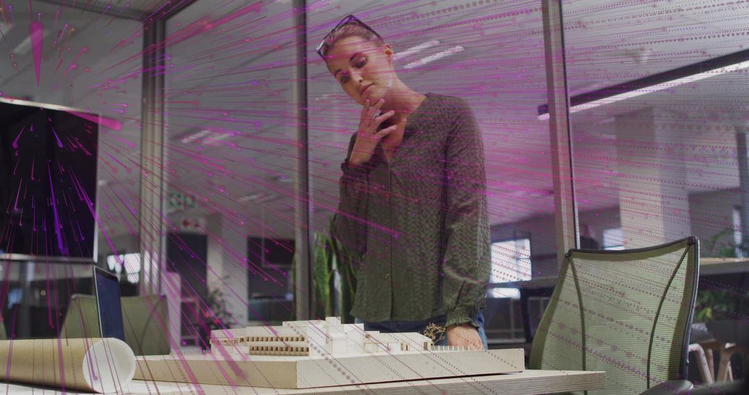 Architect Analyzing Scale Model in Modern Office