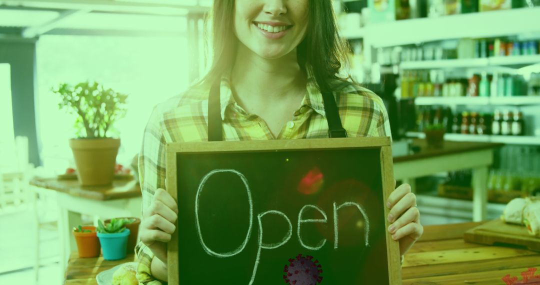 Woman Welcoming Customers with Open Sign in Cozy Cafe Environment