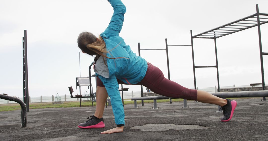 Woman Exercising Outdoors with Stretching Routine - Free Images, Stock Photos and Pictures on Pikwizard.com