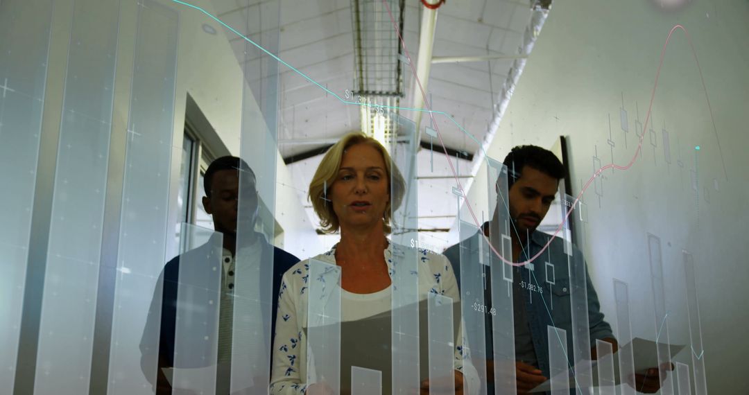 Team Analyzing Financial Charts in Corporate Hallway