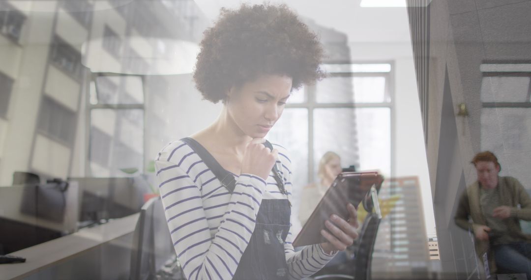 Businesswoman Analyzing Data on Digital Tablet in Office Setting