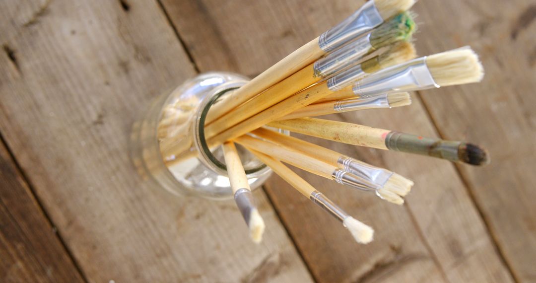 Artist Paintbrushes in Glass Jar on Rustic Wooden Table - Free Images, Stock Photos and Pictures on Pikwizard.com