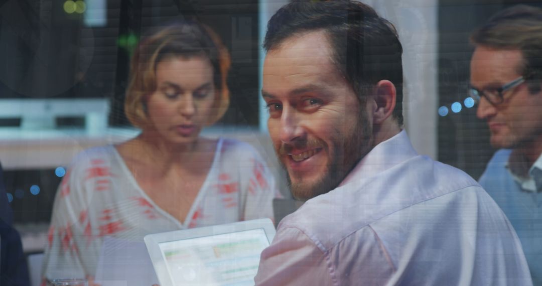 Business Team Analyzing Financial Data Over Software