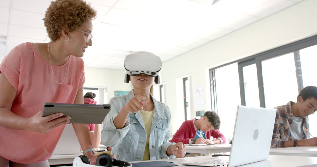 High School Student Using VR Headset Learning with Teacher Guidance