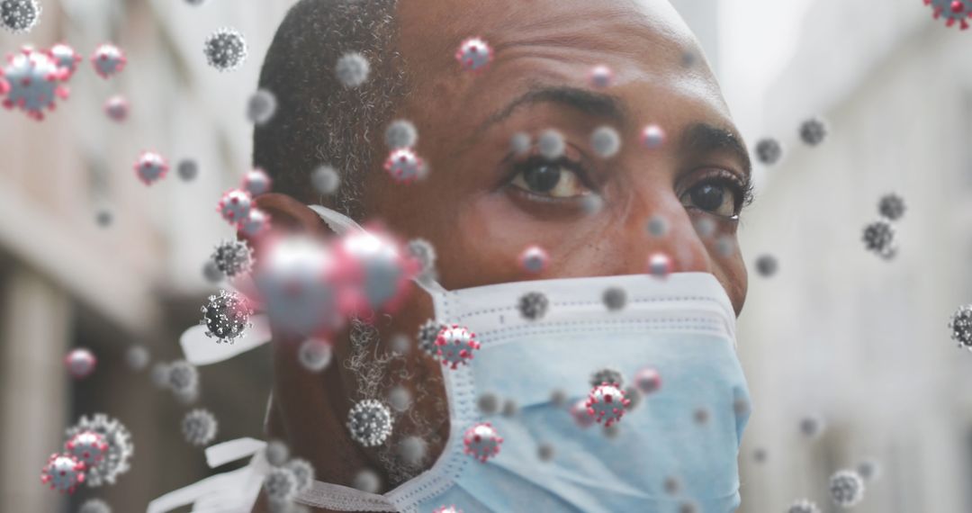 Man Wearing Face Mask Surrounded by Virus Cells Concept Image