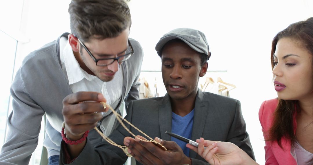 Creative Fashion Design Team Collaborating in Studio