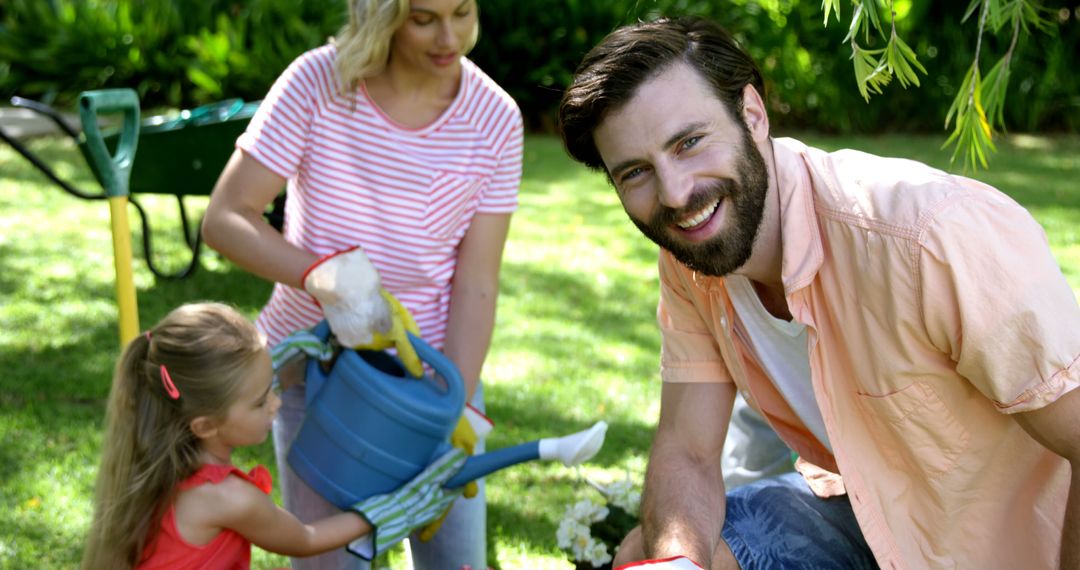 Happy Family Gardening Together on Sunny Day - Free Images, Stock Photos and Pictures on Pikwizard.com