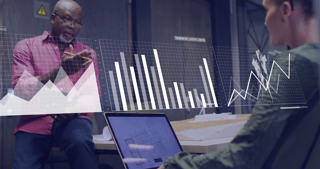 Colleagues Analyzing Data Analytics During Office Meeting