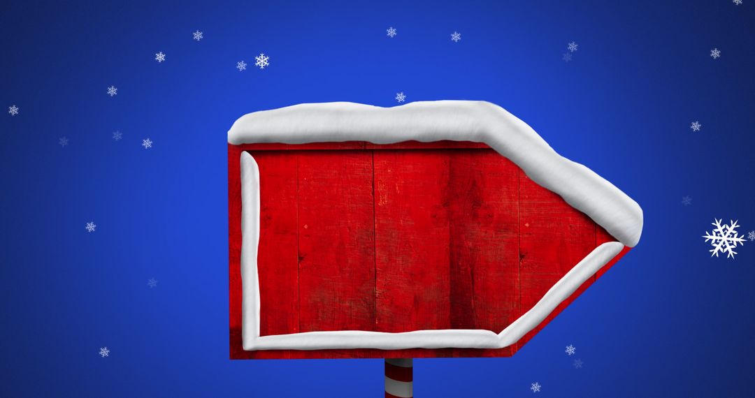 Snow-Covered Red Christmas Sign Against Blue Backdrop
