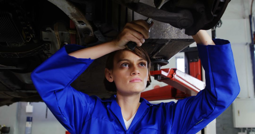 Female Mechanic Fixing Vehicle Underneath - Free Images, Stock Photos and Pictures on Pikwizard.com