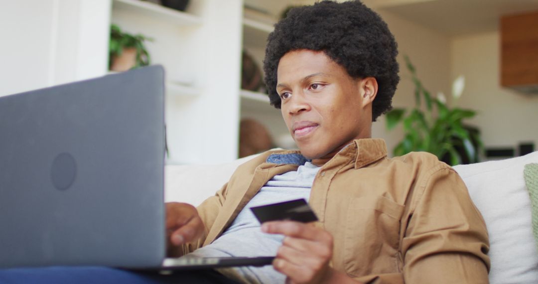 Man Shopping Online with Laptop Payment Card